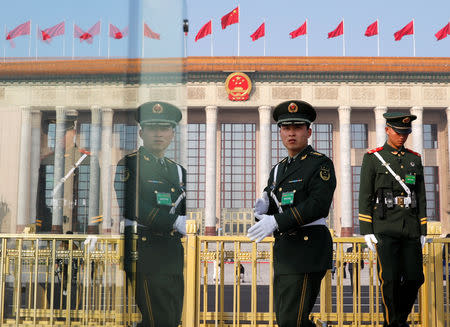 Paramilitary police officers keep watch outside the Great Hall of the People ahead of National People's Congress (NPC), China's annual session of parliament, in Beijing, China March 4, 2019. REUTERS/Aly Song