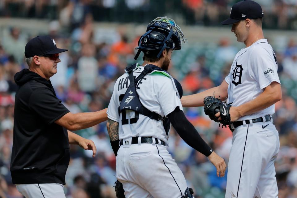 Detroit Tigers manager A.J. Hinch (left) takes the ball to relieve starting pitcher Matt Manning in the seventh inning against the Toronto Blue Jays at Comerica Park in Detroit, Michigan on July 8, 2023.