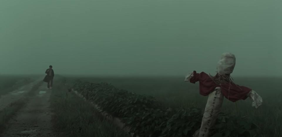 Gloomy shot from Memories of Murder with a person in the distance