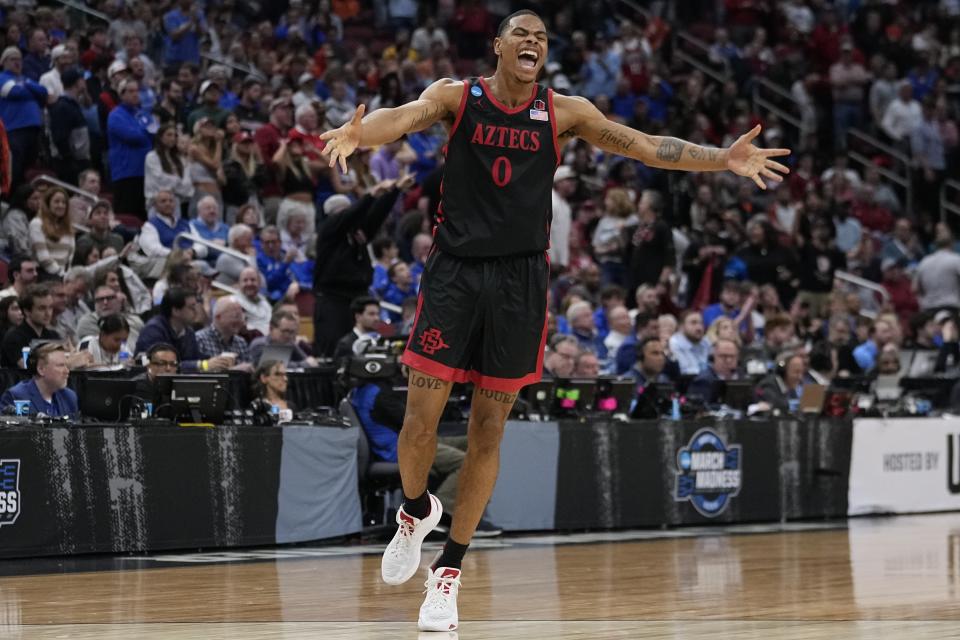 San Diego State forward Keshad Johnson (0) celebrates a win over Alabama in the second half of a Sweet 16 round college basketball game in the South Regional of the NCAA Tournament, Friday, March 24, 2023, in Louisville, Ky. San Diego State won 71-64. (AP Photo/John Bazemore)