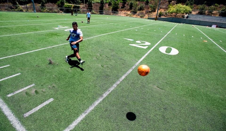 PHOTO: In this June 19, 2018, file photo, a Fullerton College soccer player works with his trainer Danny Califf at Lions Field in Fullerton, Calif. (Orange County Register via Getty Images, FILE)