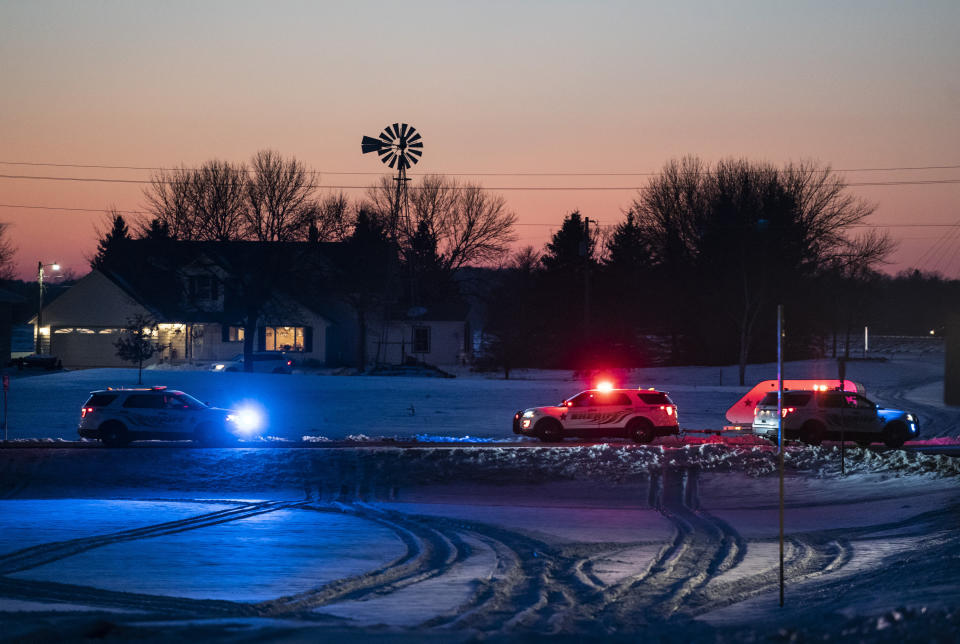 Police block off a road leading to the scene of a Blackhawk helicopter that crashed in the woods neat Marty, Minn., Thursday, Dec. 5, 2019. A Black Hawk helicopter with three crew members aboard crashed Thursday in central Minnesota, the Minnesota National Guard said, though officials did not offer any immediate information about the conditions of crew members. (Renee Jones Schneider/Star Tribune via AP)