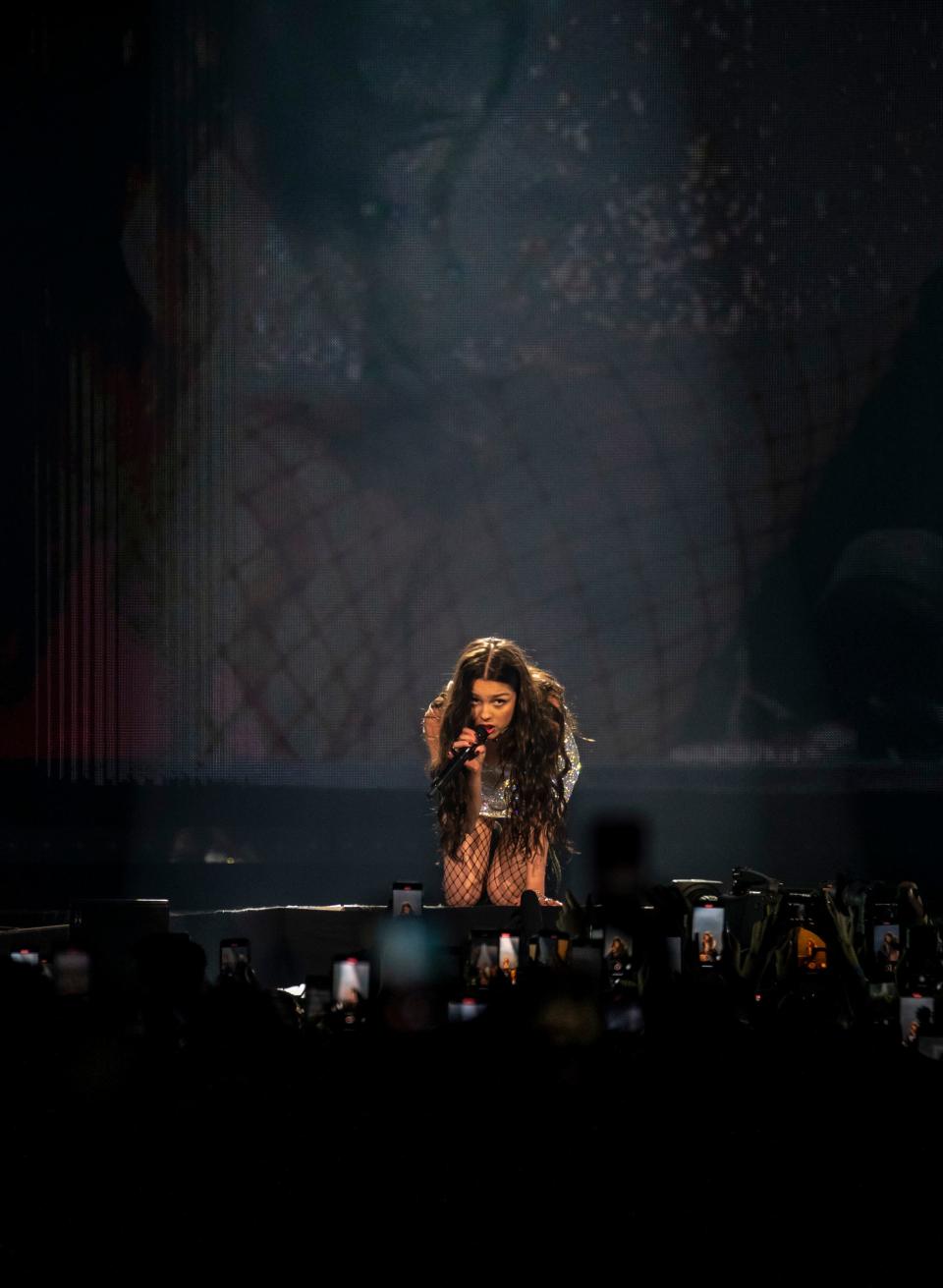 Olivia Rodrigo gets up close to fans in the front row as she sings "ballad of a homeschooled girl" during the first stop on the "Guts" tour at Acrisure Arena in Palm Desert, Calif., Friday, Feb. 23, 2024.