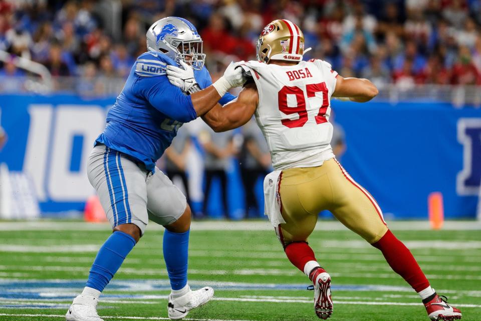 Detroit Lions offensive tackle Penei Sewell tries to stop San Francisco 49ers defensive end Nick Bosa during the first half at Ford Field in Detroit on Sunday, Sept. 12, 2021.
