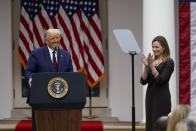 Judge Amy Coney Barrett applauds as President Donald Trump announces Barrett as his nominee to the Supreme Court, in the Rose Garden at the White House, Saturday, Sept. 26, 2020, in Washington. (AP Photo/Alex Brandon)