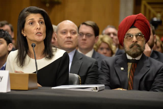 <p>Mike Theiler/UPI/Almay</p> Nikki Haley makes remarks as her father Ajit Singh Randhawa listens during Senate Foreign Relations Committee confirmation hearings on Capitol Hill on January 18, 2017.