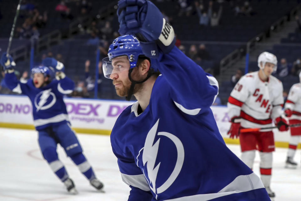 Tampa Bay Lightning's Brayden Point celebrates his goal against the Carolina Hurricanes during the second period of an NHL hockey game Tuesday, April 20, 2021, in Tampa, Fla. (AP Photo/Mike Carlson)