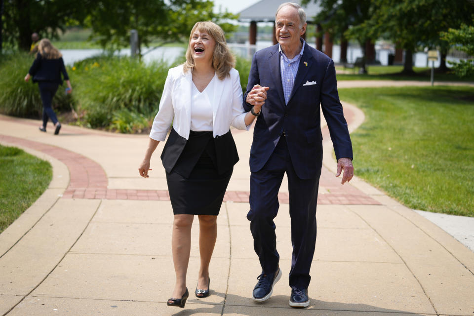 Sen. Tom Carper, D-Del., walks with his wife Martha after a news conference in Wilmington, Del., Monday, May 22, 2023. Carper announced Monday that he will not seek re-election to a fifth term in the U.S. Senate. (AP Photo/Matt Rourke)