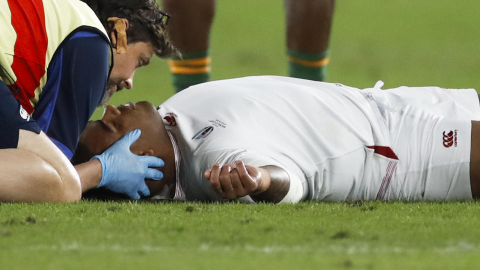 England's prop Kyle Sinckler receives medical attention during the Japan 2019 Rugby World Cup final match. (Photo by Odd Andersen / AFP) (Photo by ODD ANDERSEN/AFP via Getty Images)