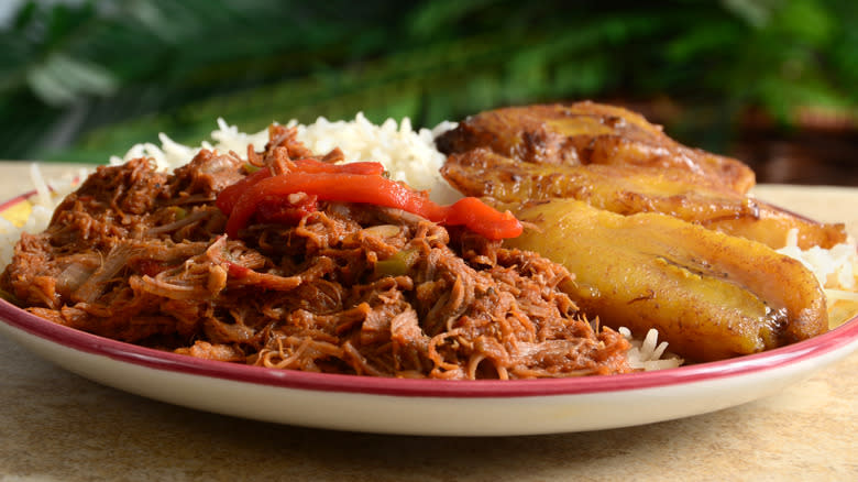 ropa vieja with white rice on a plate