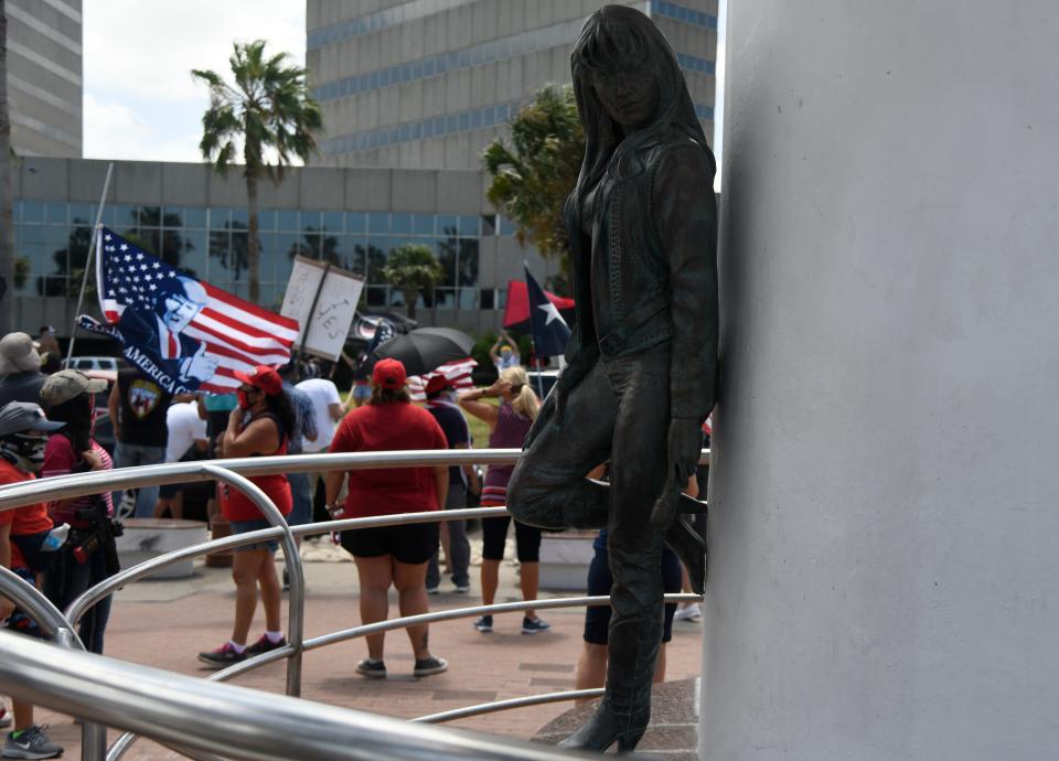 Trump supporters gather at the Selena statue, Saturday, July 11, 2020. About 40 people attended the event plus counter protesters. 