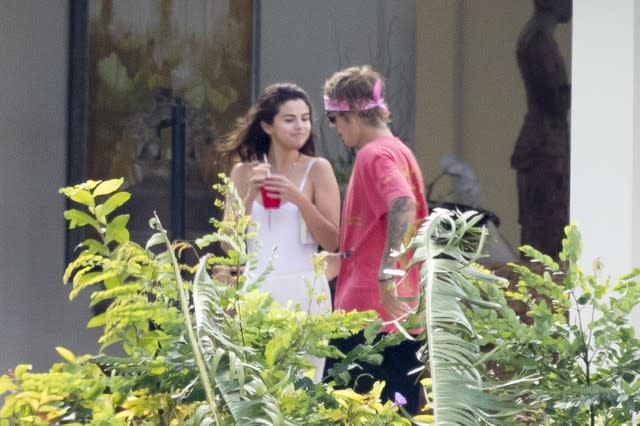 The couple headed to the Caribbean for Bieber's father's wedding on Monday.