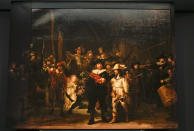 View of Rembrandt's biggest painting the Night Watch which just got bigger with the help of artificial intelligence, see added sides, in Amsterdam, Netherlands, Wednesday, June 23, 2021. The Dutch national museum and art gallery Rijksmuseum reveals findings from a long-term project to examine in minute detail Rembrandt van Rijn's masterpiece the Night Watch. (AP Photo/Peter Dejong)