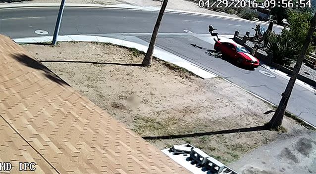 The man flies over the car while his bicycle is crushed underneath the wheels. Photo: YouTube/BlueHorse Solutions