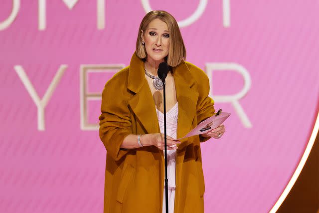 <p>Kevin Winter/Getty Images</p> Céline Dion presenting the album of the year award at the Grammys on Feb. 4, 2024 in Los Angeles