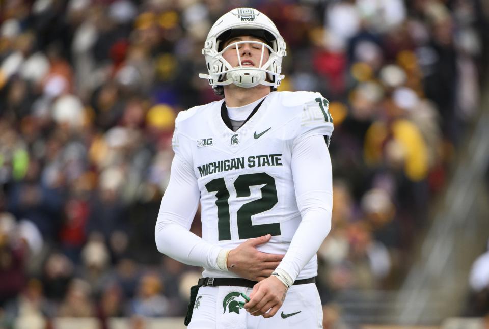 Katin Houser of the Michigan State Spartans reacts after being hit on a play in the first quarter against the Minnesota Golden Gophers at Huntington Bank Stadium on October 28, 2023 in Minneapolis, Minnesota.