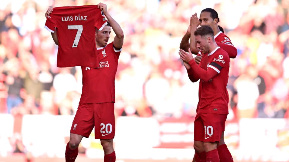 Diogo Jota held up Díaz's shirt after scoring on Sunday. - Andrew Powell/Liverpool FC/Getty Images
