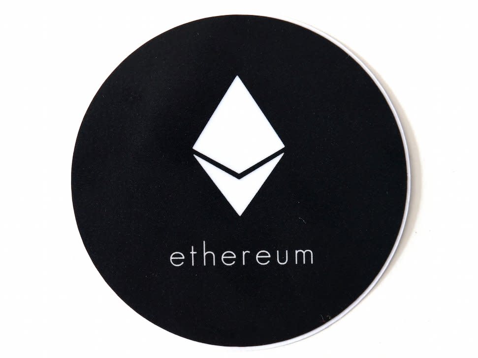 The Ethereum logo seen at the Ethereum DEV offices in Berlin, Germany, 14 April 2015. Ethereum is an open source platform that hosts applications and data on a decentralized network. While the block chain technology of the cryptocurrency Bitcoin is restricted to finance, this concerns applications that would normally require escrow services like, for example, financial applications, social networking applications, notaries or booking services that need to save and validate verifiable data. Photo: