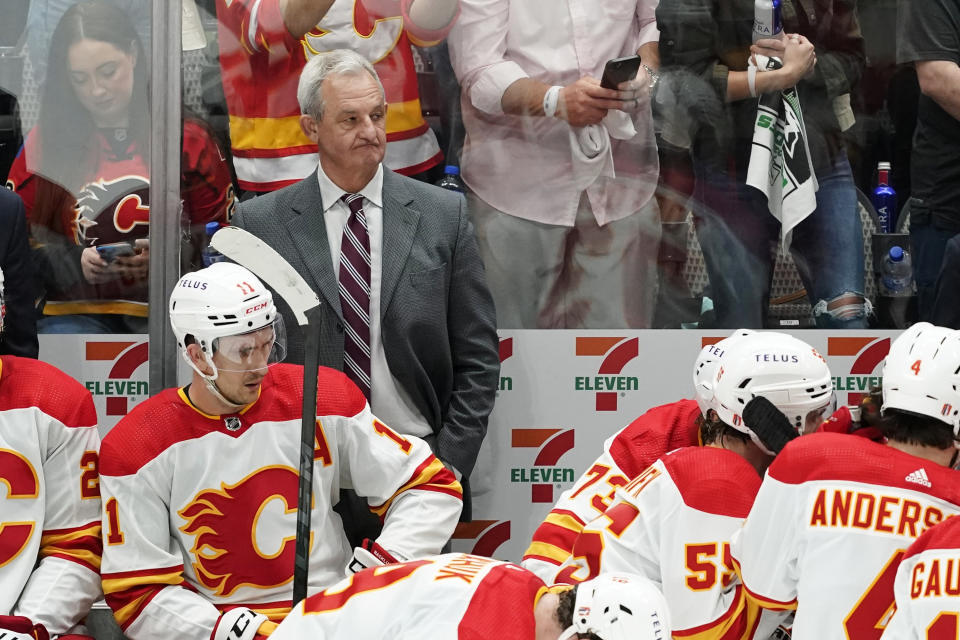 Calgary Flames coach Darryl Sutter watches play in the closing minutes of Game 3 of the team's NHL hockey Stanley Cup first-round playoff series against the Dallas Stars, Saturday, May 7, 2022, in Dallas. (AP Photo/Tony Gutierrez)