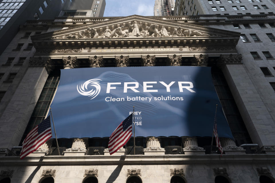 File - A banner for Norway's battery cell startup Freyr hangs on the facade of the New York Stock Exchange to mark the company listing, Thursday, July 8, 2021. Freyr is planning its next factory in an Atlanta suburb because a new U.S. clean energy law offers generous tax credits for local production. (AP Photo/Mark Lennihan, File)