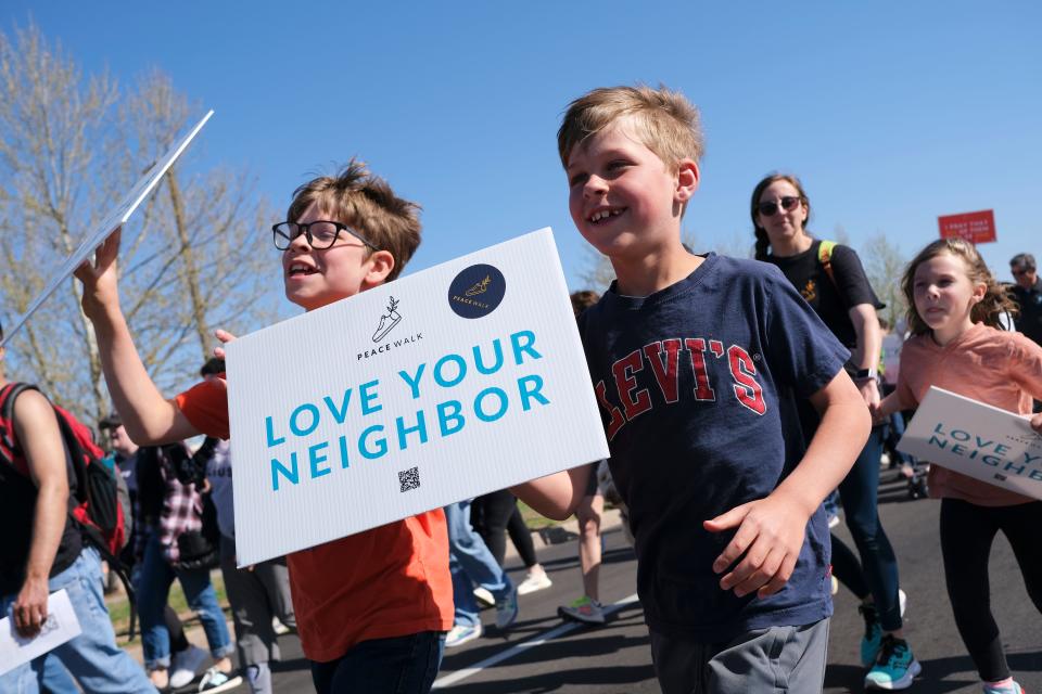 People march north on Martin Luther King Jr Blvd. at the Dream Peace Walk in Oklahoma City from Douglass High School to the Bridge Impact Youth Center, to celebrate the anniversary of Dr. Rev. Martin Luther King, Jr's Letters from Birmingham,  Sunday, April 16, 2023.