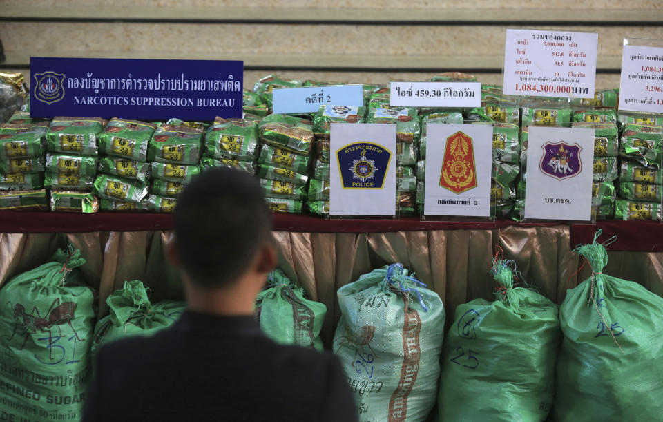 FILE - In this July 15, 2019, file photo, reporters view packages of seize 459 kilograms (1,012 pounds) of crystal methamphetamine on a table during a press conference at Narcotics Suppression Bureau Bangkok, Thailand. United Nation's Office on Drugs and Crime, said the cumulative value of the methamphetamine market is more than $60 billion this year. Facilitated by organized crime, the market has expanded since a 2013 study found the accumulated value was $15 billion.(AP Photo/File)