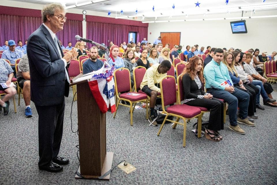 Harvey Arnold moderates a veterans panel at Indian River State College in this undated image.