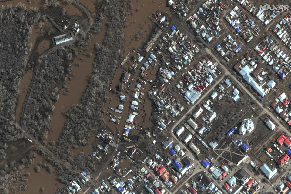 This image provided by Maxar Technologies, shows flooded areas in Sorochinsk, Russia, Tuesday, April 9, 2024. State media say Russia's government has declared the situation in flood-hit areas in the Orenburg region a federal emergency. (Satellite image ©2024 Maxar Technologies via AP)