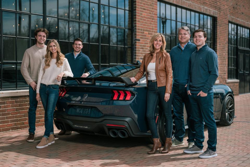 Laurie Transou, chief engineer of the Mustang program, works at Ford along with her husband, daughter and sons. They're seen here at Phoenix Mills in Plymouth on March 26, 2023. From left: Tom Wojan, a Ford summer finance intern from Michigan State University; Claire Wojan, Ford product financial analyst; R J Transou, battery buyer; Laurie Transou; Rob Transou, global purchasing director, ICE propulsion and thermal systems, Rob Transou, global purchasing director, ICE propulsion and thermal systems and Nolan Transou, Ford College Graduate Program participant who rotates through different business units every 18 months or so.