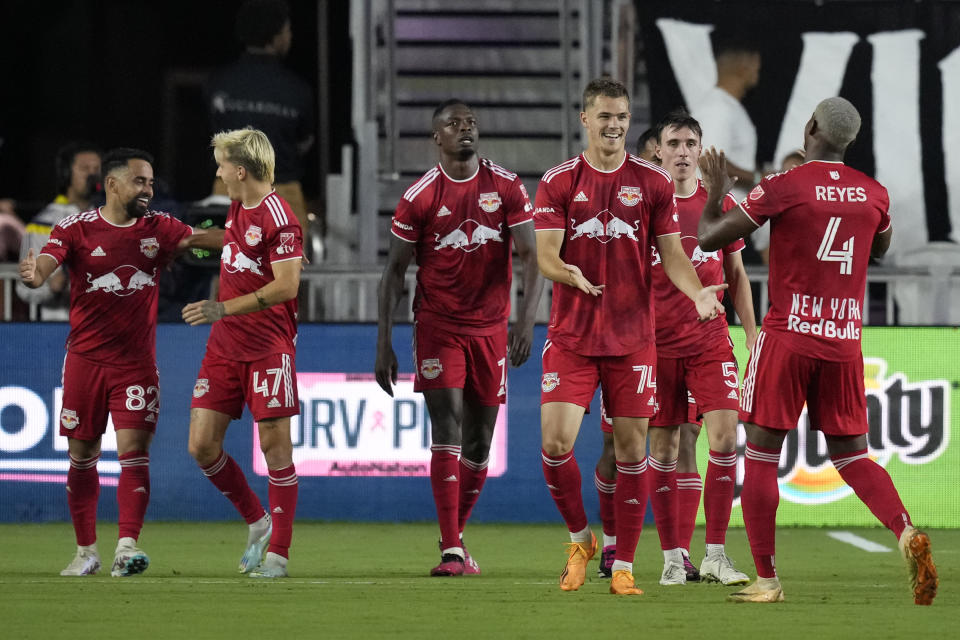New York Red Bulls forward Tom Barlow (74) celebrates with teammates after scoring a goal against Inter Miami during the second half of an MLS soccer match Wednesday, May 31, 2023, in Fort Lauderdale, Fla. The Red Bulls won 1-0.(AP Photo/Rebecca Blackwell)