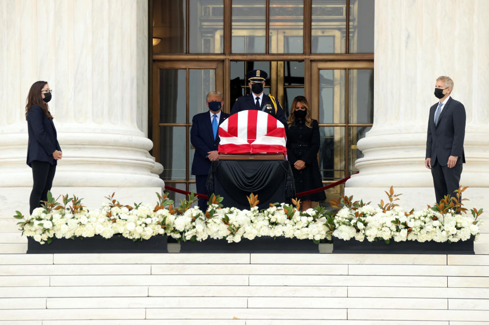 President Donald Trump and first lady Melania Trump pay their respects to late Justice Ruth Bader Ginsburg as her casket lies in repose at the top of the steps of the U.S. Supreme Court building in Washington on September 24, 2020. / Credit: Jonathan Ernst / REUTERS