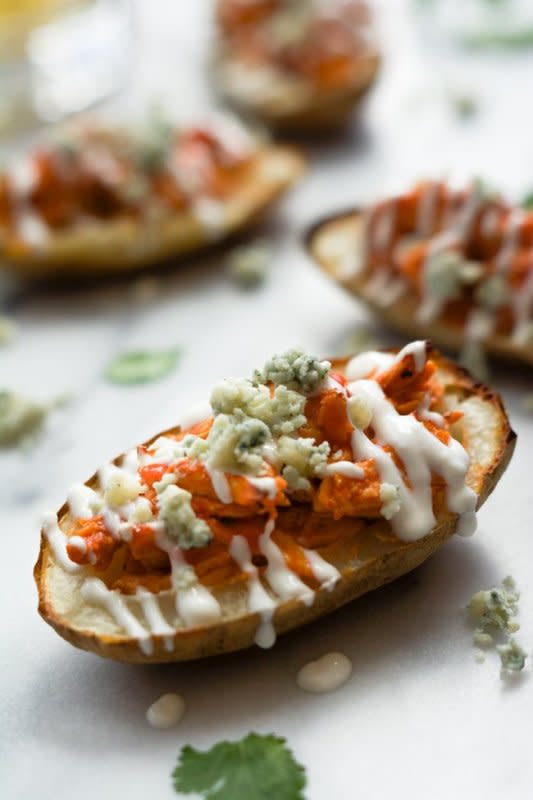 <p>With Salt and Wit</p><p>Buffalo Chicken Stuffed Potato Skins with Honey Blue Cheese Sauce are the perfect party food! </p><p><strong>Get the recipe: <a href="http://withsaltandwit.com/buffalo-chicken-stuffed-potato-skins/" rel="nofollow noopener" target="_blank" data-ylk="slk:Buffalo Chicken Stuffed Potato Skins;elm:context_link;itc:0;sec:content-canvas" class="link rapid-noclick-resp">Buffalo Chicken Stuffed Potato Skins</a></strong></p>