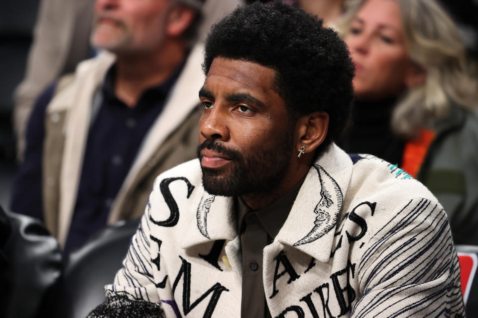 Kyrie Irving watches the Brooklyn Nets-New York Knicks game as a spectator at the Barclays Center in Brooklyn on March 13, 2022. (Tayfun Coskun/Anadolu Agency via Getty Images)