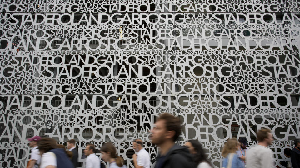 Spectators head to the courts during first round matches at the French Open tennis tournament in Roland Garros stadium in Paris, France, Sunday, May 22, 2022. (AP Photo/Christophe Ena)