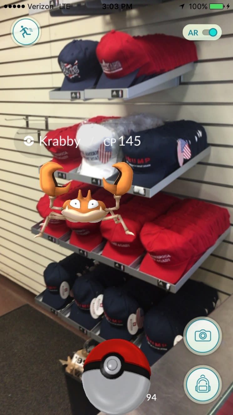 Capturing a Krabby Pokémon on top of a pile of Donald Trump 