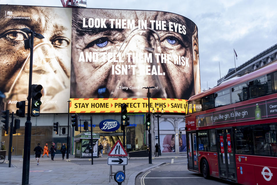A government NHS (National Heath Service) advert displays the face of a Covid patient, urging Londoners to stay at home and not to take risks or bend the rules during the third lockdown of the Coronavirus pandemic, at Piccadilly Circus in the capital's West End, on 3rd February 2021, in London, England. (Photo by Richard Baker / In Pictures via Getty Images)
