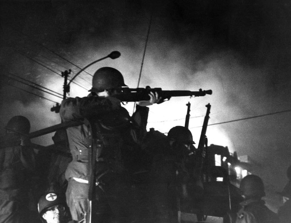 A National Guardsman aims his rifle during Chicago riots in 1968 after Martin Luther King Jr. was assassinated.