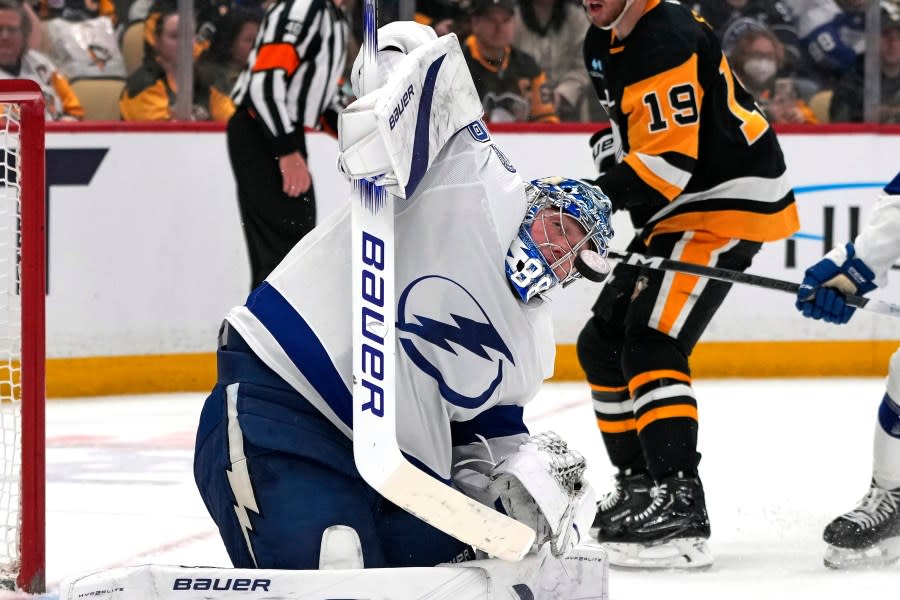 Tampa Bay Lightning goaltender <a class="link " href="https://sports.yahoo.com/nhl/players/5699/" data-i13n="sec:content-canvas;subsec:anchor_text;elm:context_link" data-ylk="slk:Andrei Vasilevskiy;sec:content-canvas;subsec:anchor_text;elm:context_link;itc:0">Andrei Vasilevskiy</a> (88) blocks a shot during the second period of an NHL hockey game against the Pittsburgh Penguins in Pittsburgh, Saturday, April 6, 2024. (AP Photo/Gene J. Puskar)