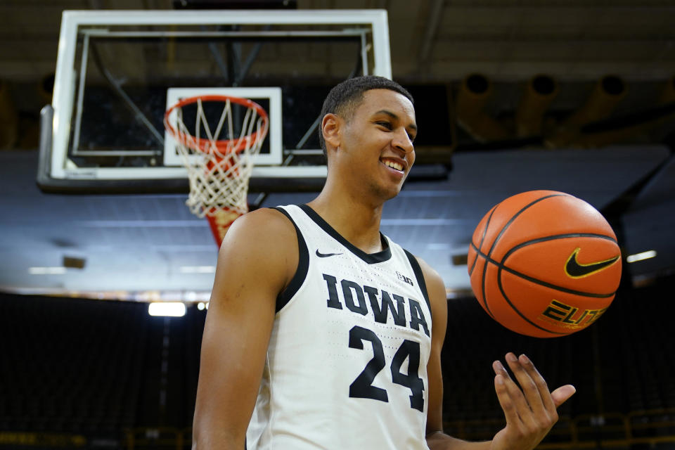 Iowa forward Kris Murray poses for photographers during Iowa's NCAA college basketball media day, Wednesday, Oct. 5, 2022, in Iowa City, Iowa. (AP Photo/Charlie Neibergall)