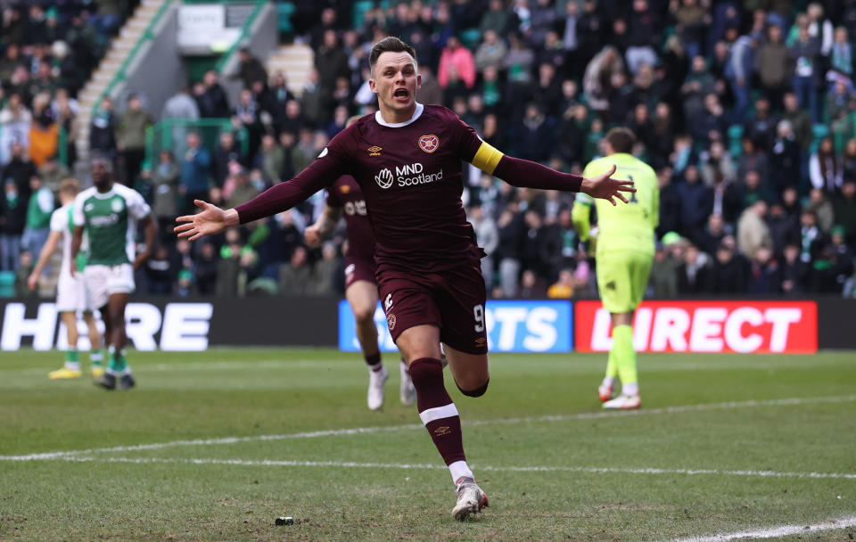 Lawrence Shankland scored the second of three Hearts goals before being sent off to secure a win for the Jambos at Easter Road.