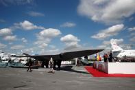 French President Emmanuel Macron attends the unveiling of the French-German-Spanish new generation fighter model during a visit the 53rd International Paris Air Show at Le Bourget Airport