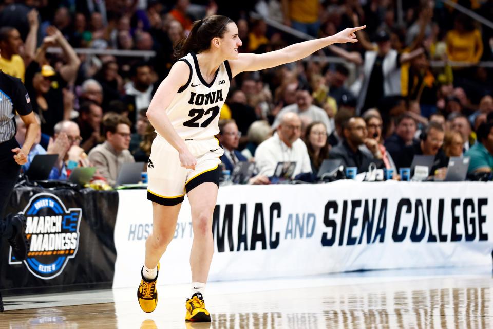 Iowa Hawkeyes guard Caitlin Clark (22) added to her legend Monday night with an epic 41-point performance in a 94-87 victory over defending national champion LSU and Angel Reese.