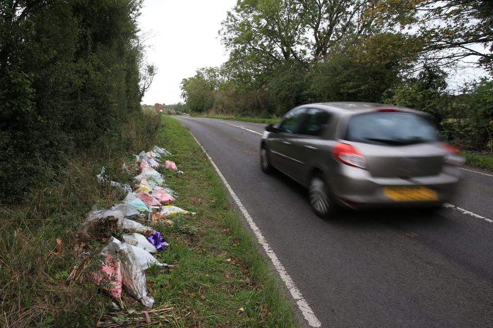 Floral tributes lay on the roadside near RAF Croughton in Northamptonshire, central England on October 10, 2019, at the spot where British motorcyclist Harry Dunn was killed as he travelled along the B4031 on August 27. - Dunn was killed on August 27 when his motorbike collided with a car near a Royal Air Force base in Northamptonshire in central England, which is used by the US military as a communications hub. (Photo by Lindsey Parnaby / AFP) (Photo by LINDSEY PARNABY/AFP via Getty Images)