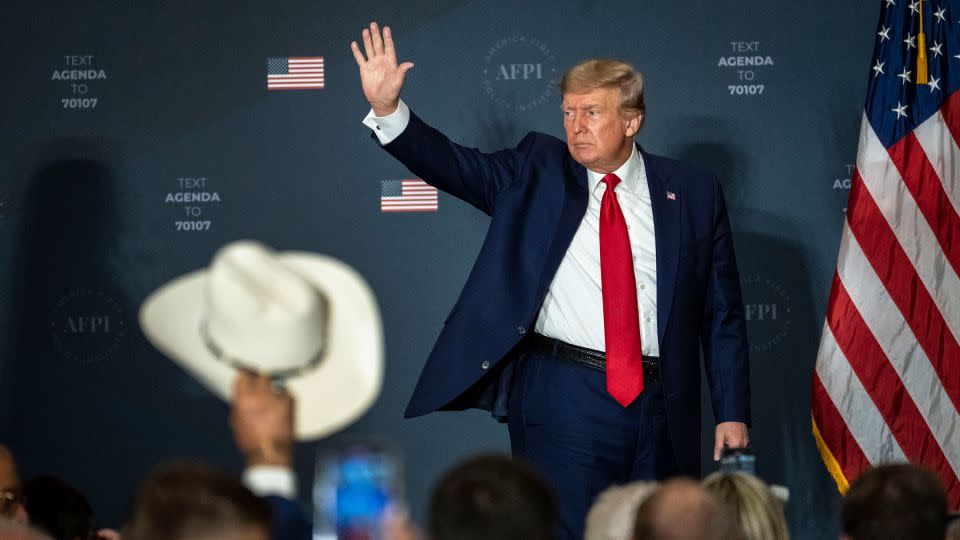 In this July 2022 photo, Trump waves to a crowd attending the America First Agenda Summit at the Marriott Marquis hotel in Washington, DC. - Drew Angerer/Getty Images North America/Getty Images