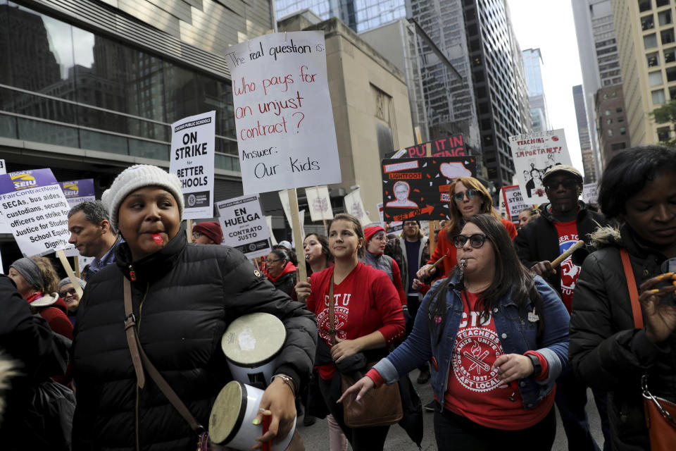 Striking Chicago Public Schools teachers and supporters rally in front of CPS headquarters in downtown Chicago on Thursday, Oct. 17, 2019. (Abel Uribe/Chicago Tribune via AP)