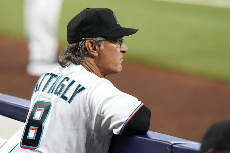 Miami Marlins manager Don Mattingly (8) watches a baseball game against the Philadelphia Phillies, Saturday, April 16, 2022, in Miami. (AP Photo/Lynne Sladky)