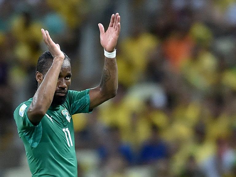 Ivory Coast's forward and captain Didier Drogba celebrates after his team scored during a Group C football match between Greece and Ivory Coast at the Castelao Stadium in Fortaleza during the 2014 FIFA World Cup on June 24, 2014