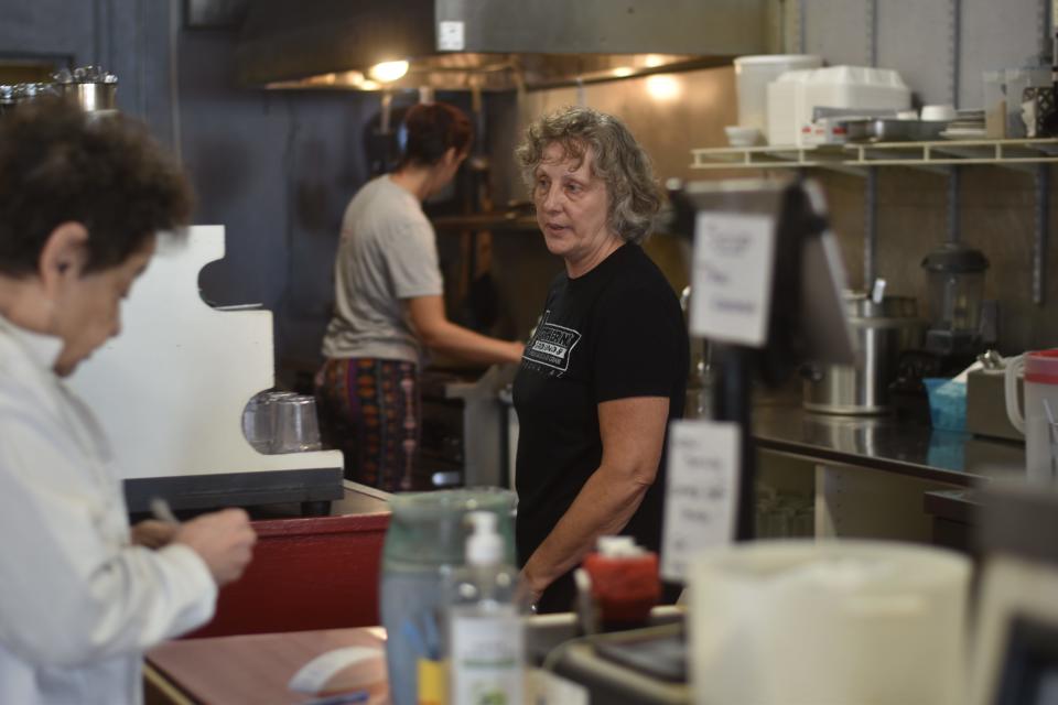 Patagonia Mayor Andrea Wood working at Gathering Grounds, a cafe owned by her daughter and son-in-law.