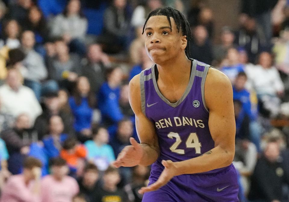 Ben Davis Giants KJ Windham (24) claps his hands after scoring three-points Friday, Jan. 27, 2023 at Carmel High School in Carmel. The Ben Davis Giants defeated the Carmel Greyhounds, 46-45. 