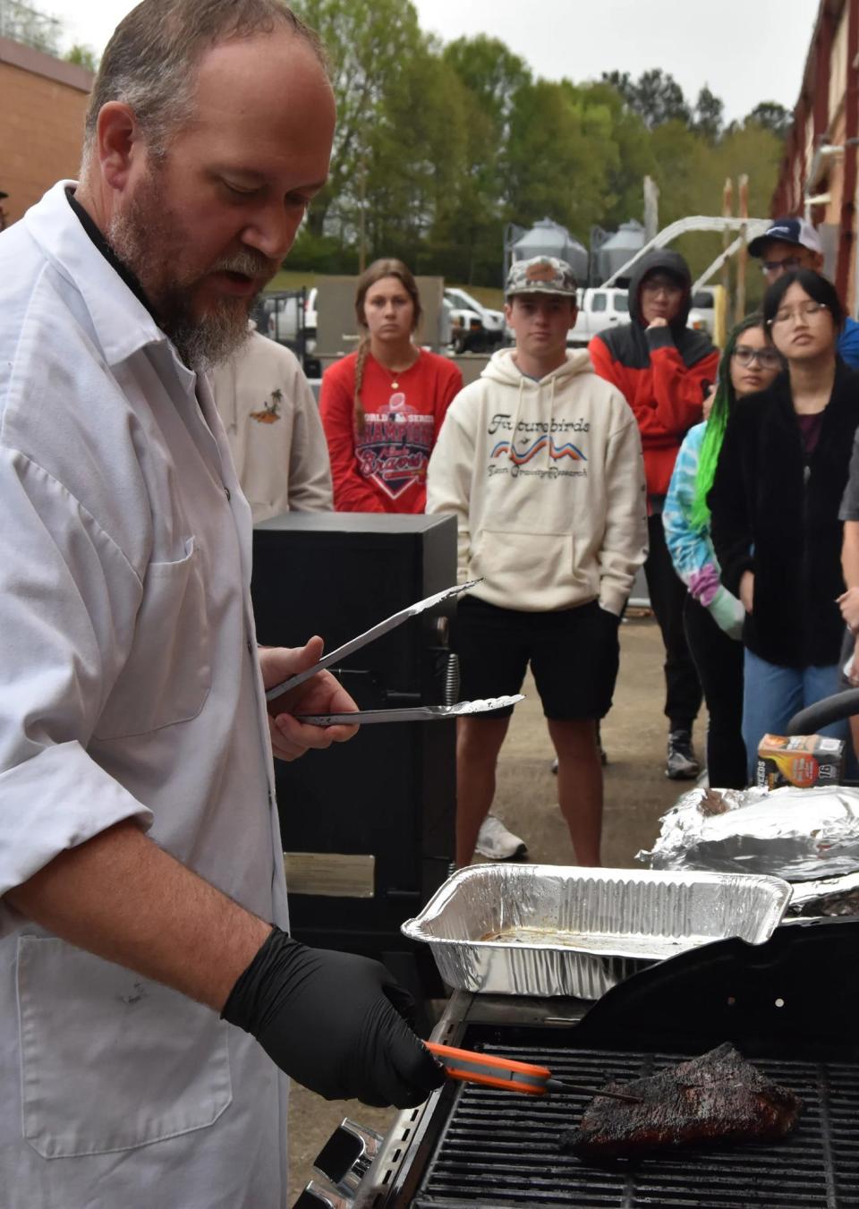 Alexander Stelzleni instructs students in the UGA Department of Animal and Dairy Science's "BBQ and You" seminar class at the College of Agricultural and Environmental Sciences.